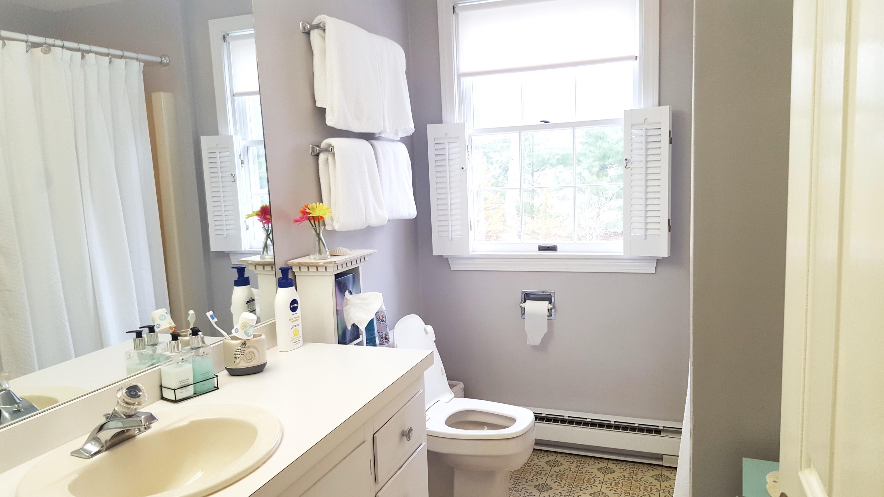 8 Nehoiden Road Mashpee, MA 02649 - Photo 13 of 47 a bathroom with a granite countertop sink toilet and mirror