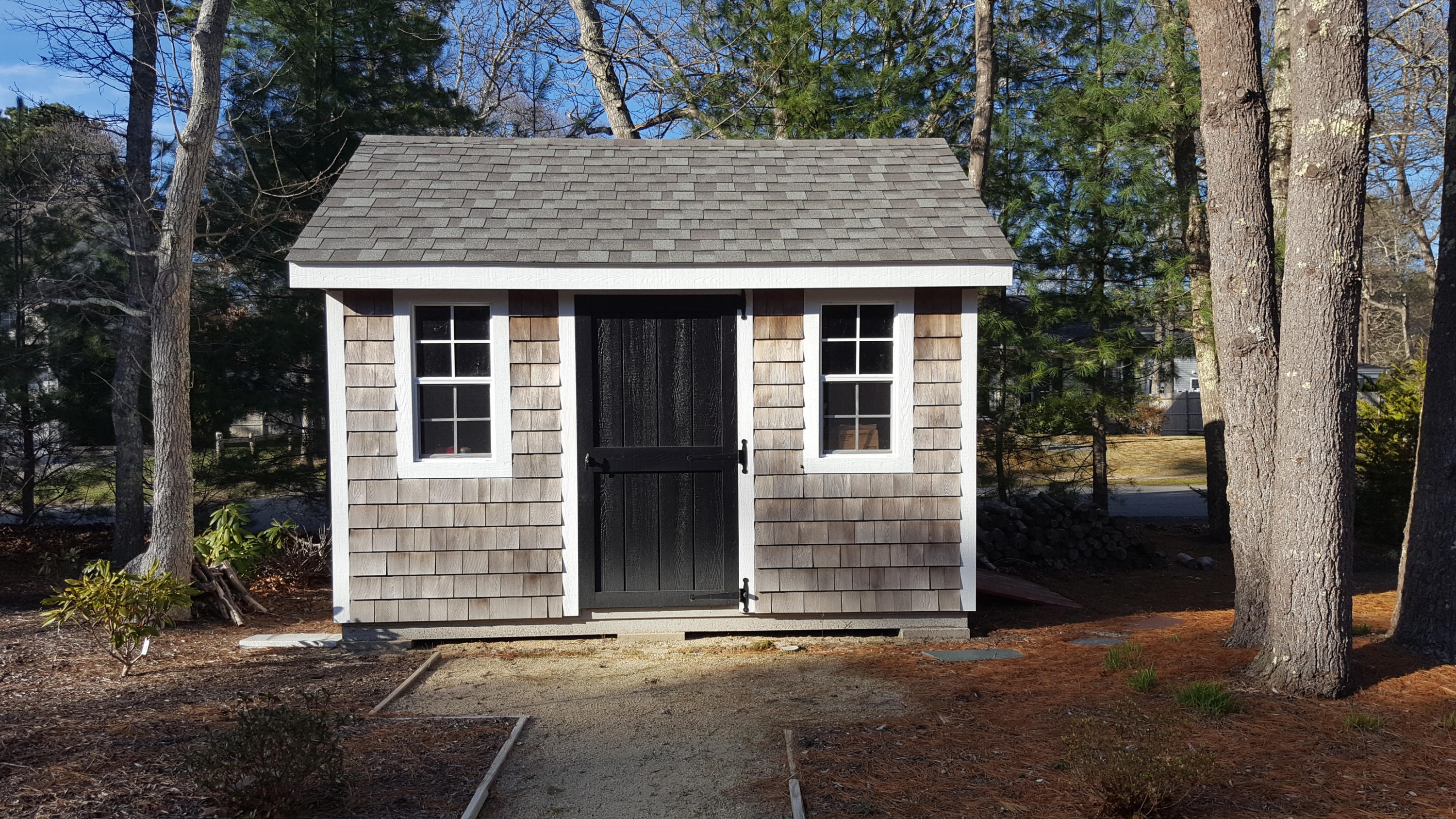 8 Nehoiden Road Mashpee, MA 02649 - Photo 17 of 47 front view of a house with a yard