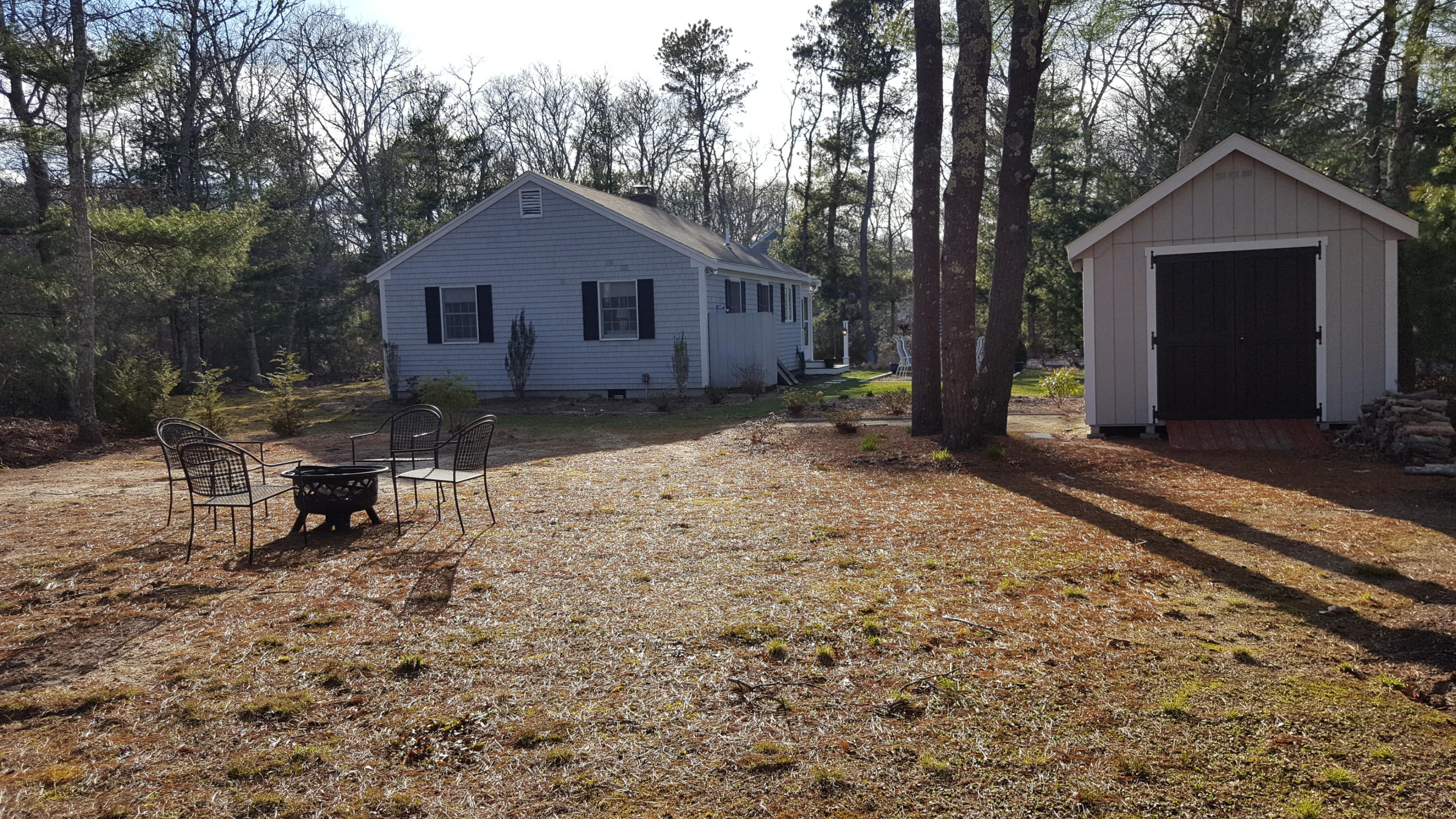 8 Nehoiden Road Mashpee, MA 02649 - Photo 20 of 47 a view of a house with a yard covered in snow