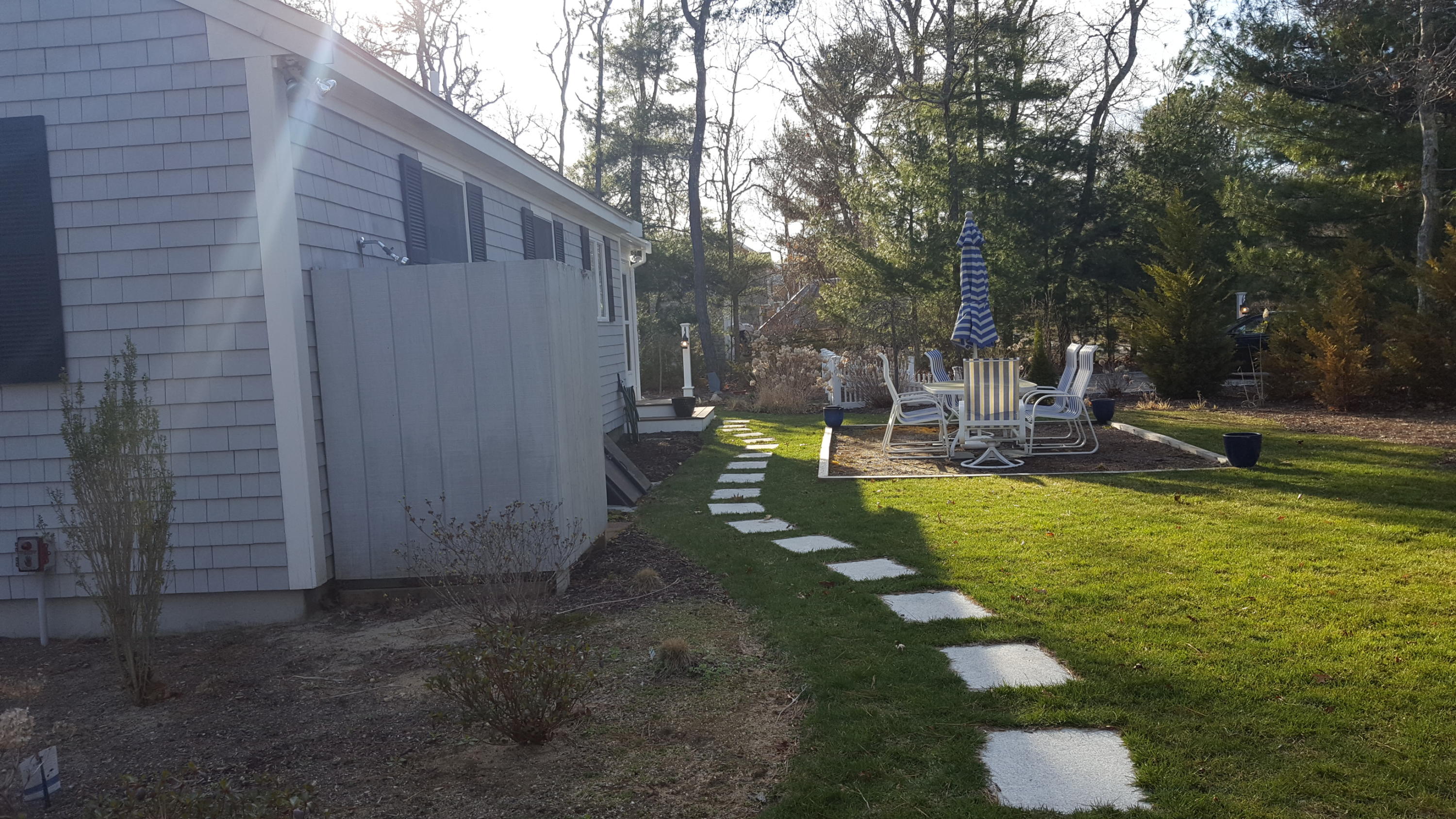 8 Nehoiden Road Mashpee, MA 02649 - Photo 21 of 47 a view of a chair in back yard of the house
