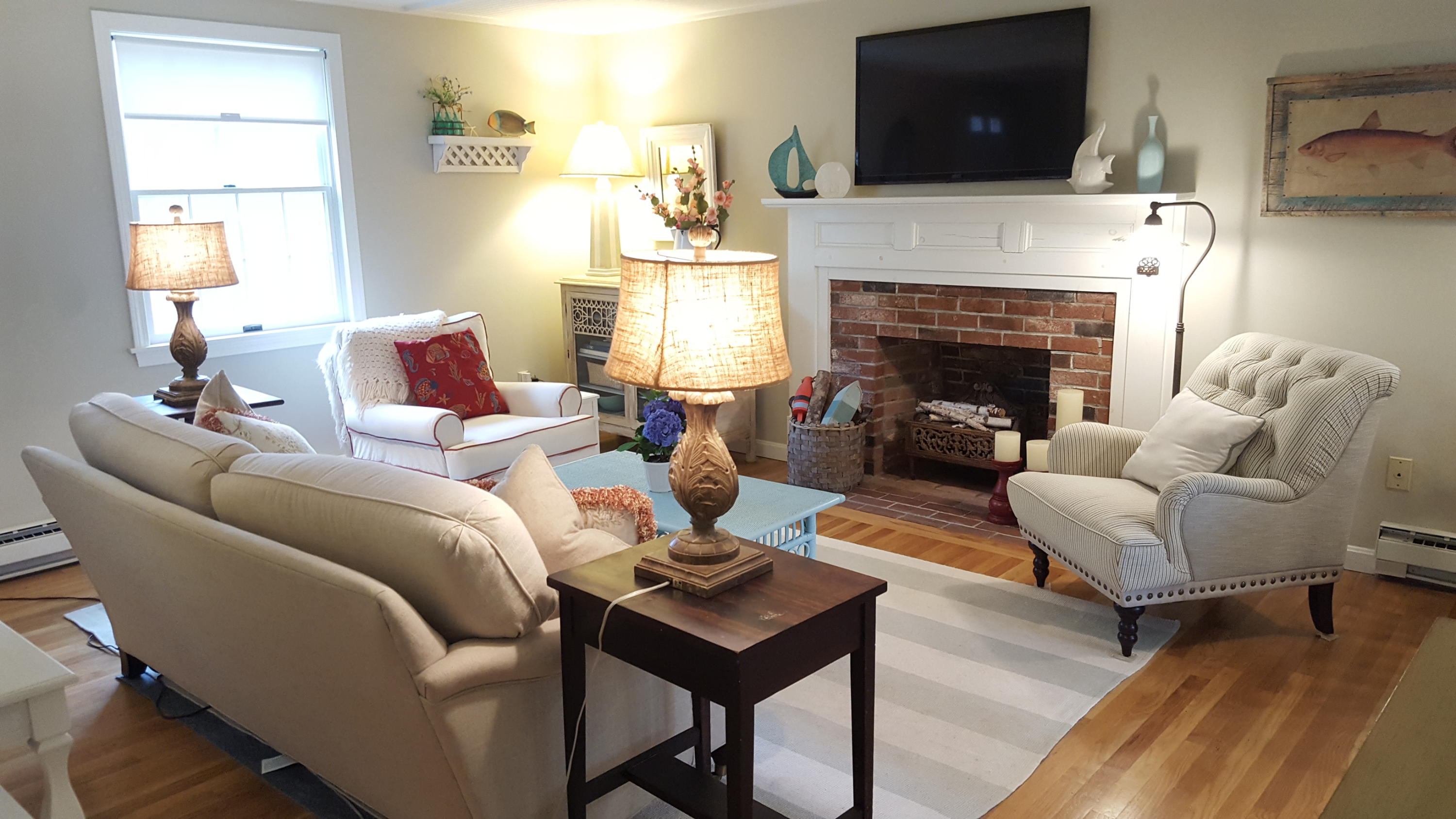 8 Nehoiden Road Mashpee, MA 02649 - Photo 7 of 47 a living room with furniture and a fireplace