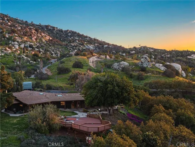 an aerial view of a house with a garden