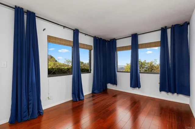 a view of a room with a large window