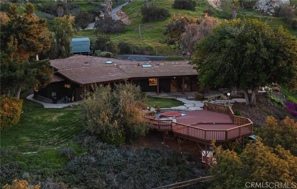 15735 Highland Valley Road Escondido, CA 92025 - Photo 3 of 38 a backyard of a house with yard and outdoor seating