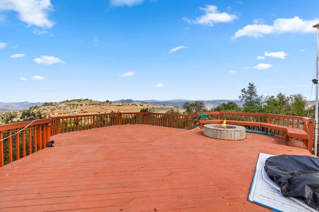 15735 Highland Valley Road Escondido, CA 92025 - Photo 32 of 38 a view of a swimming pool with an ocean view