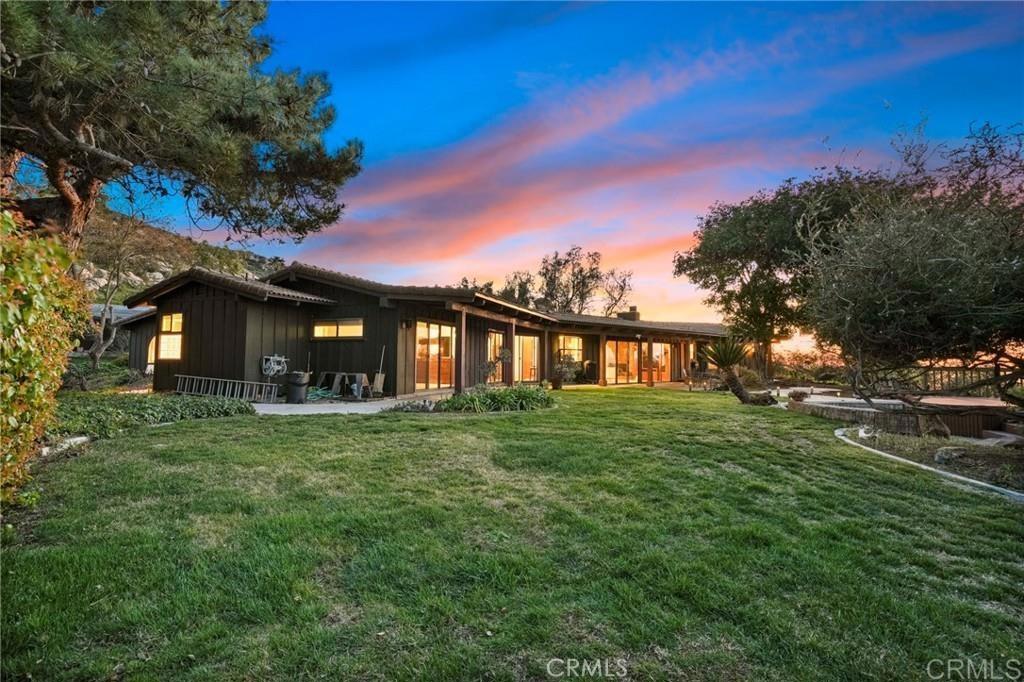 15735 Highland Valley Road Escondido, CA 92025 - Photo 8 of 38 a front view of a house with a garden