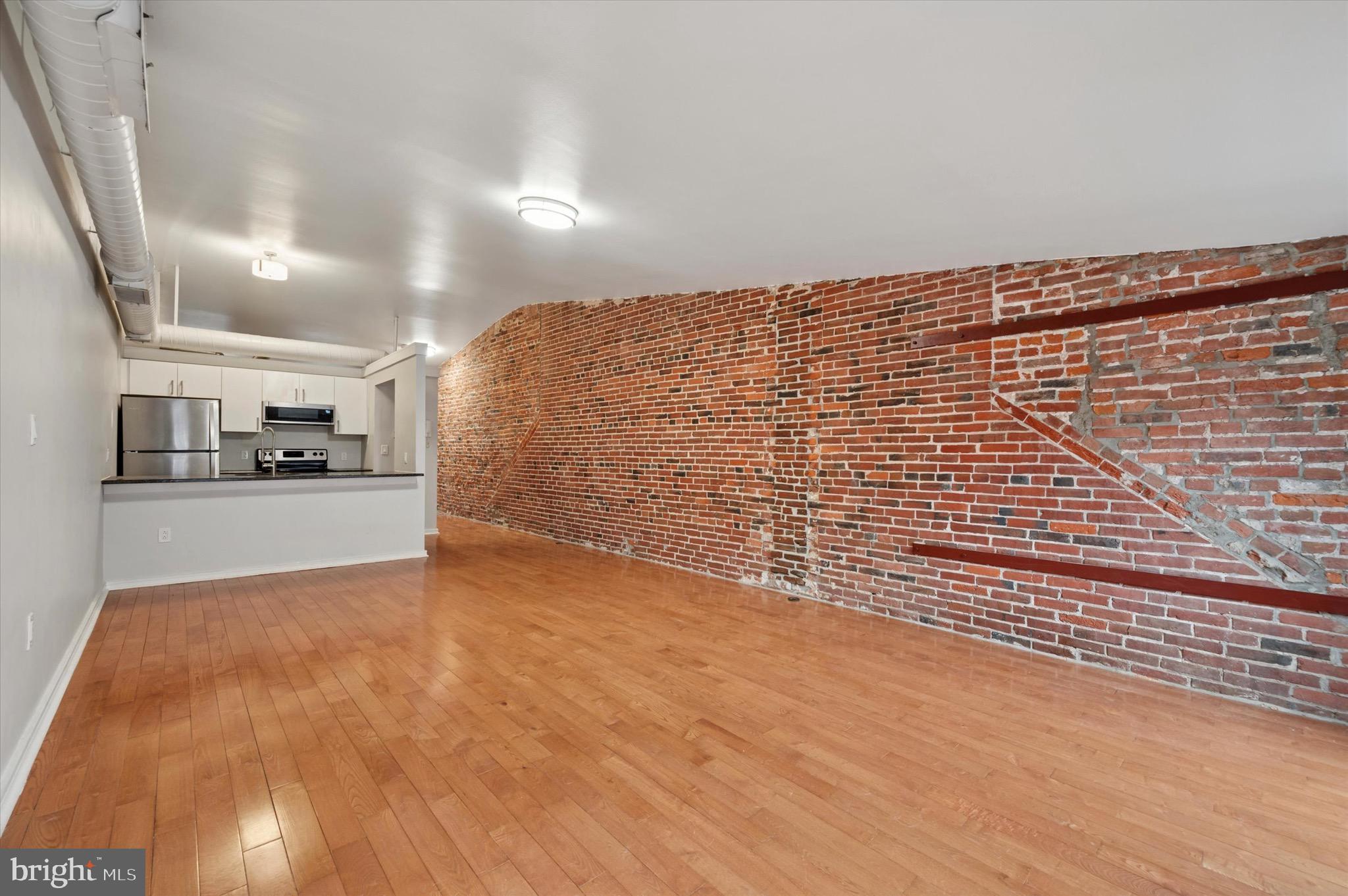 222 Church Street, Unit 2J Philadelphia, PA 19106 - Photo 15 of 17 a view of kitchen with wooden floor