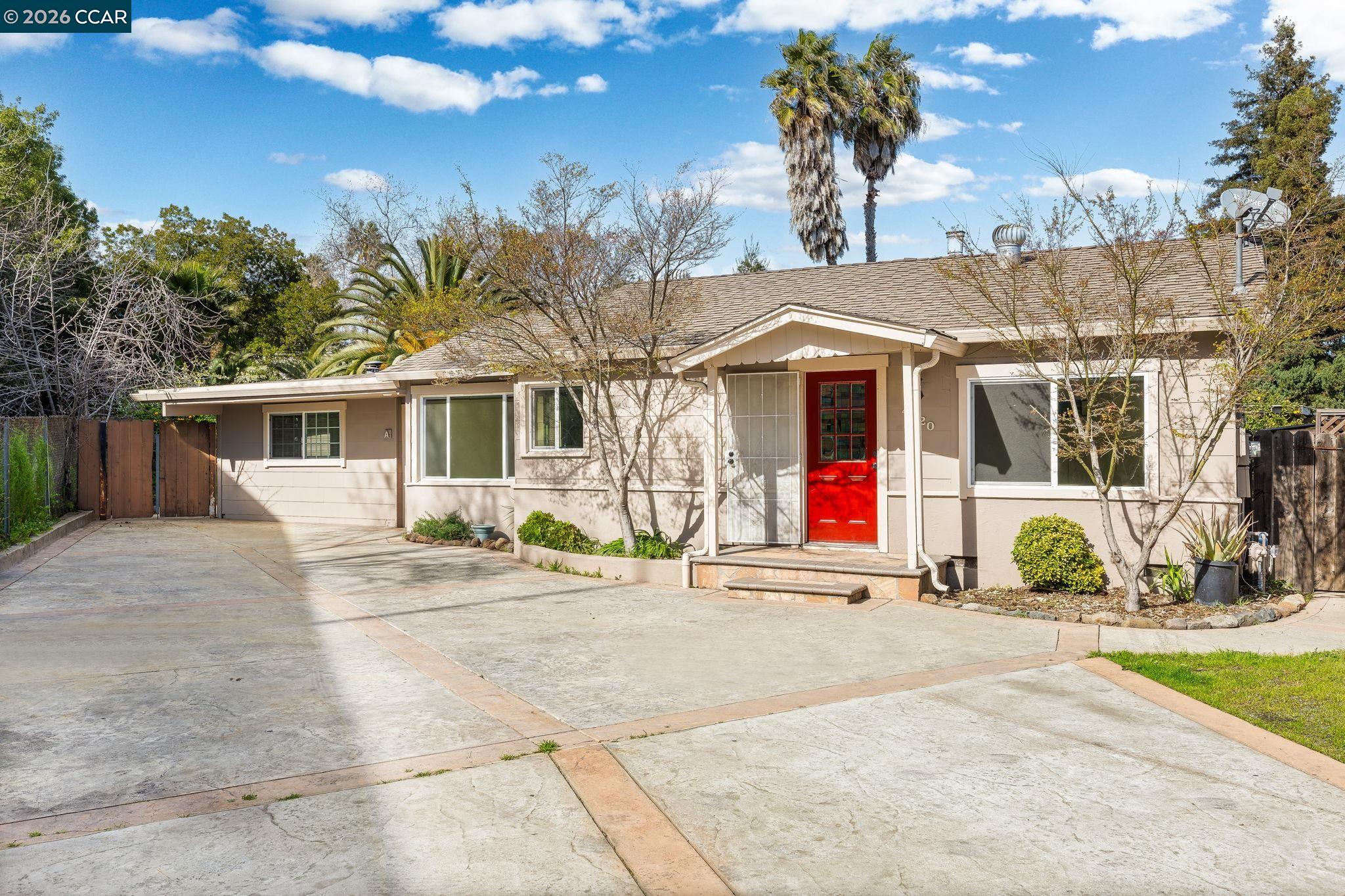 4820 Blum Road Martinez, CA 94553 - Photo 1 of 46 a front view of a house with basket ball court and potted plants