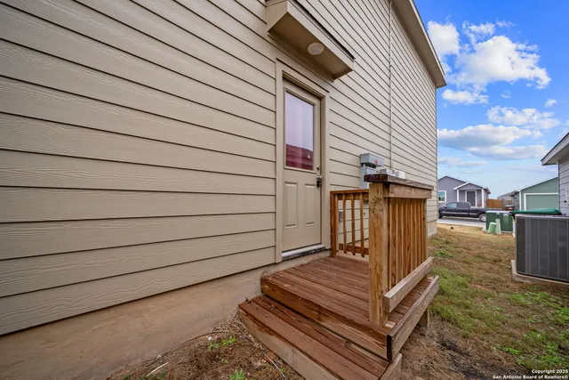 a view of a back yard of the house