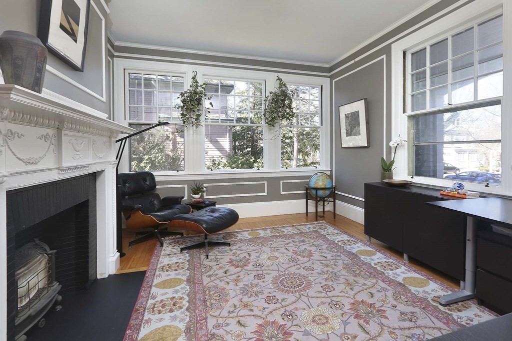 240 Clinton Road Brookline, MA 02445 - Photo 13 of 24 a living room with furniture and a fireplace