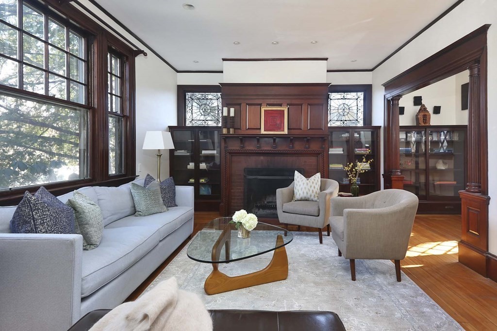 240 Clinton Road Brookline, MA 02445 - Photo 5 of 24 a living room with furniture a lamp and a large window