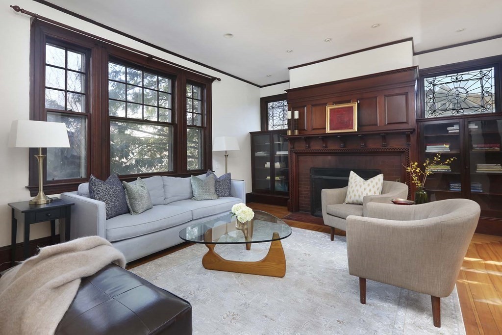 240 Clinton Road Brookline, MA 02445 - Photo 6 of 24 a living room with furniture and a large window