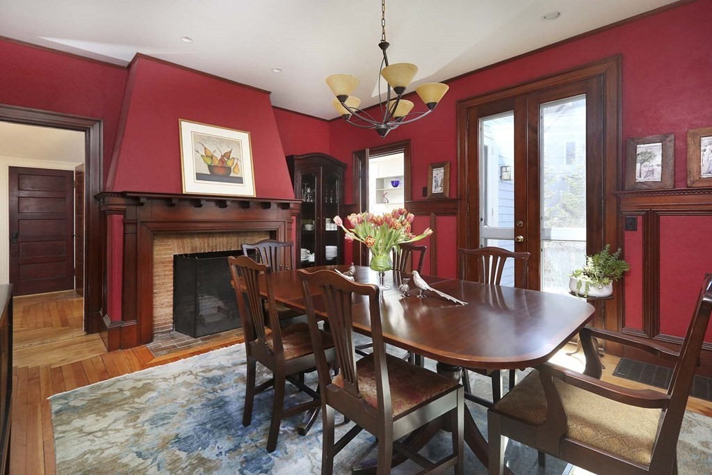 240 Clinton Road Brookline, MA 02445 - Photo 8 of 24 a view of a dining room with furniture and a chandelier