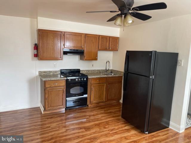 922 South 19th Street, Unit 3 Philadelphia, PA 19146 - Photo 1 of 6 a kitchen with a refrigerator and a sink