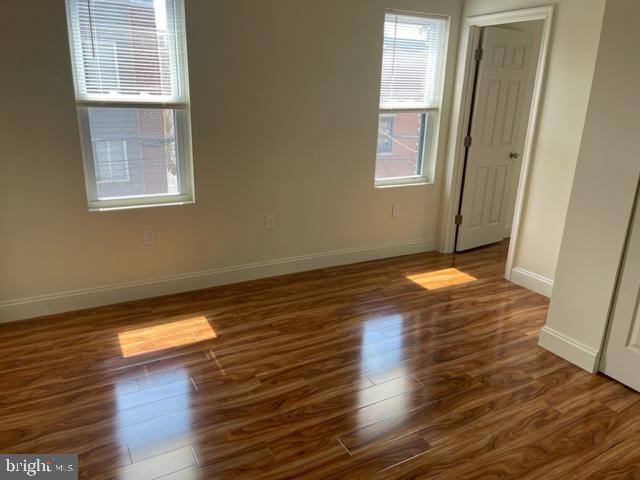 922 South 19th Street, Unit 3 Philadelphia, PA 19146 - Photo 3 of 6 a view of a room with wooden floor and window
