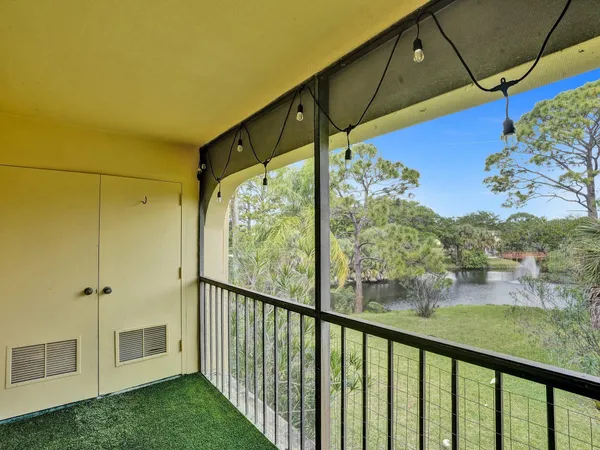 a view of a porch with a big yard