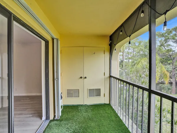 a view of a back yard from a balcony
