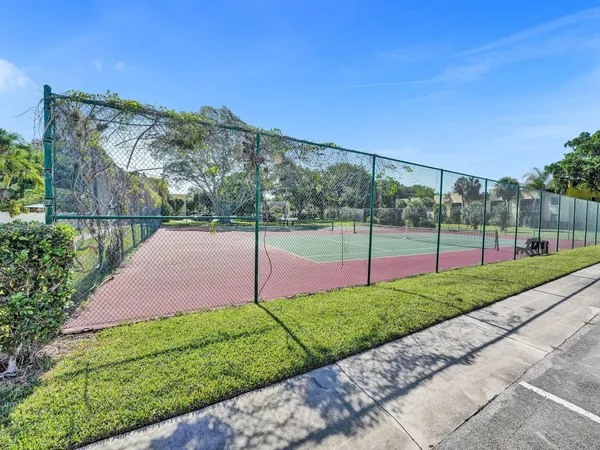 a view of a backyard with swimming pool