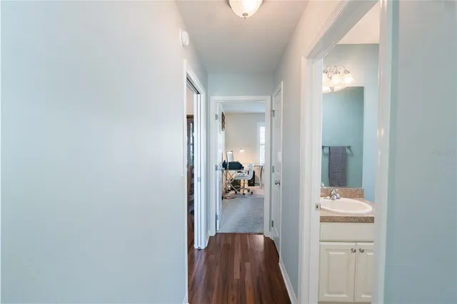 a en suite bathroom with a sink and mirror