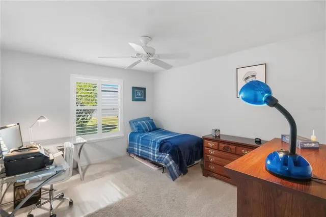 a bedroom with furniture and a window