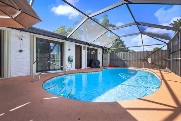 a view of a swimming pool with a patio