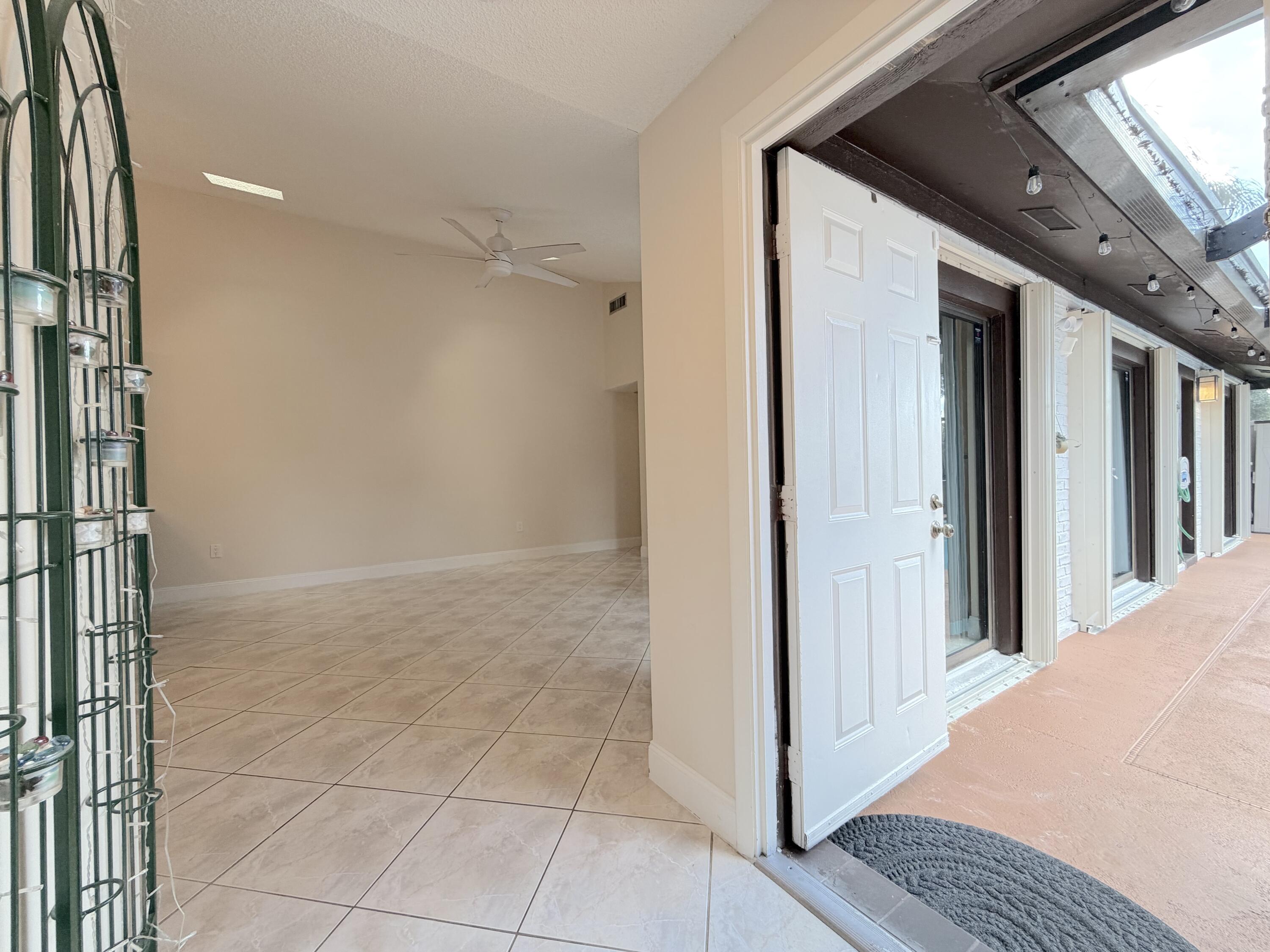 9927 Boca Gardens Trail, Unit A Boca Raton, FL 33496 - Photo 14 of 63 Front Door/Living Room