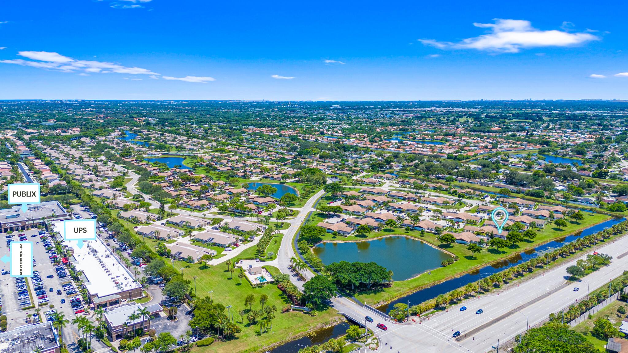 9927 Boca Gardens Trail, Unit A Boca Raton, FL 33496 - Photo 54 of 63 an aerial view of residential houses with outdoor space and trees