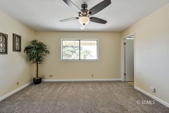 418 North Inyo Street Ridgecrest, CA 93555 - Photo 17 of 35 wooden floor in an empty room with a window