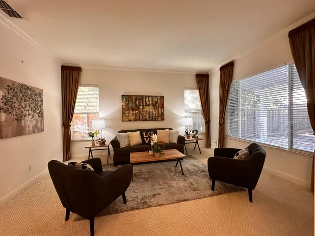a view of a sink storage and utility room with a window