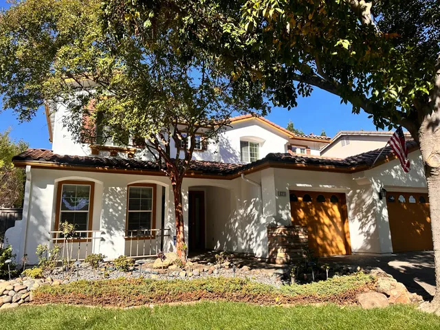 a front view of a house with a yard outdoor seating and yard