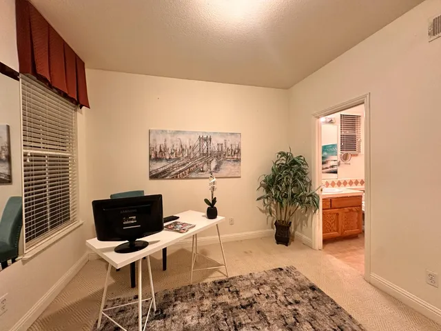 a bathroom with a sink a toilet a mirror and vanity