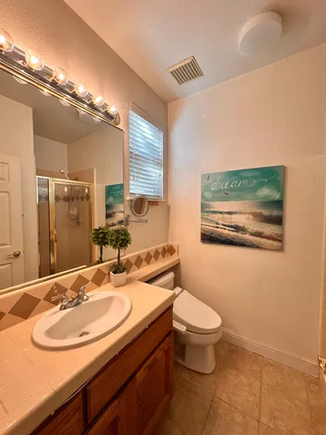 a room with a sink cabinets and utility