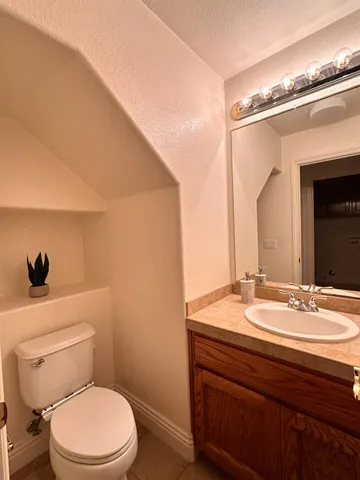 a bathroom with a toilet and a sink