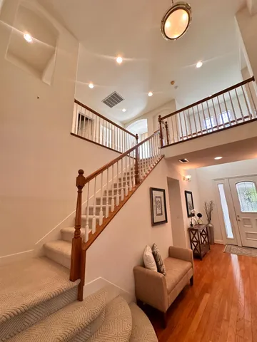 a bedroom with furniture and a window