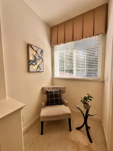 a spacious bedroom with a bed a couch and dresser