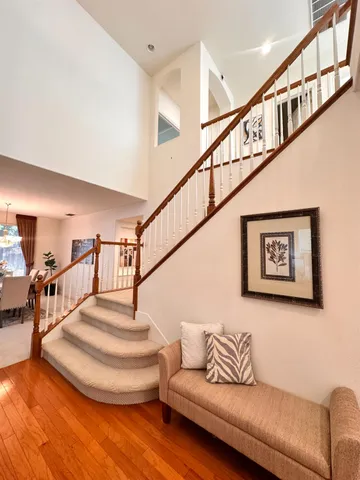 a view of a livingroom with furniture and staircase