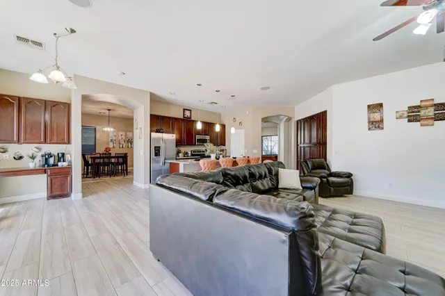 a kitchen with sink stove and cabinets