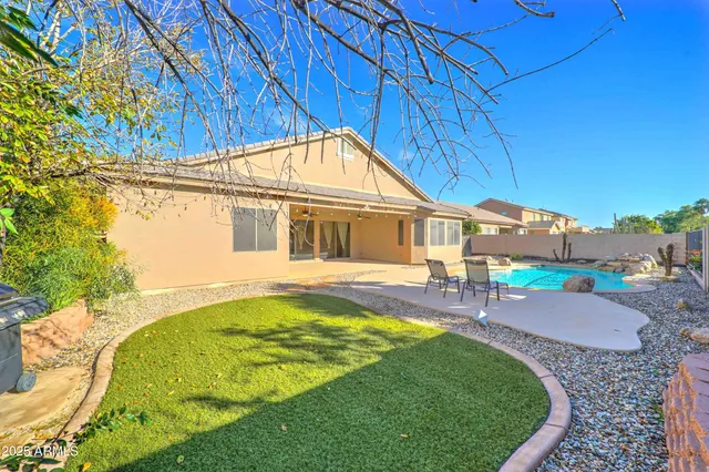 a house view with swimming pool and outdoor space