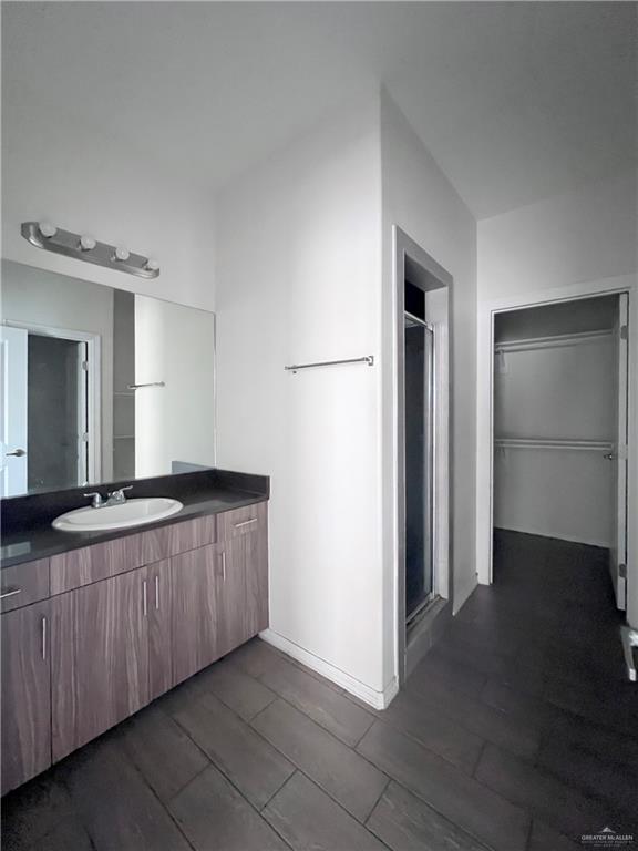 1609 West Cortlandt Street, Unit 3 Edinburg, TX 78541 - Photo 12 of 21 a spacious bathroom with a granite countertop sink and a mirror