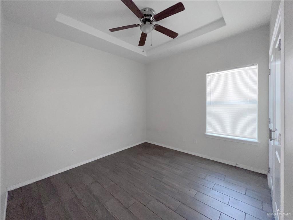 1609 West Cortlandt Street, Unit 3 Edinburg, TX 78541 - Photo 19 of 21 an empty room with a window and a fan