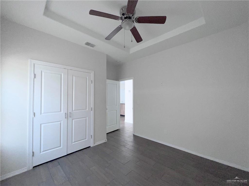 1609 West Cortlandt Street, Unit 3 Edinburg, TX 78541 - Photo 20 of 21 an empty room with a ceiling fan