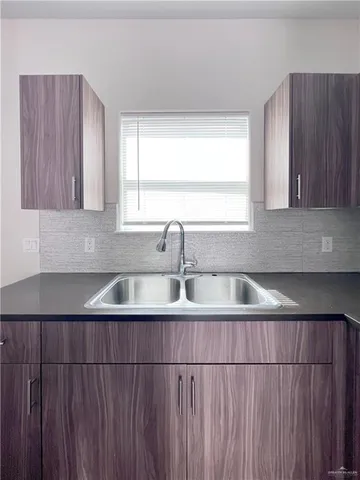 a view of kitchen with wooden floor