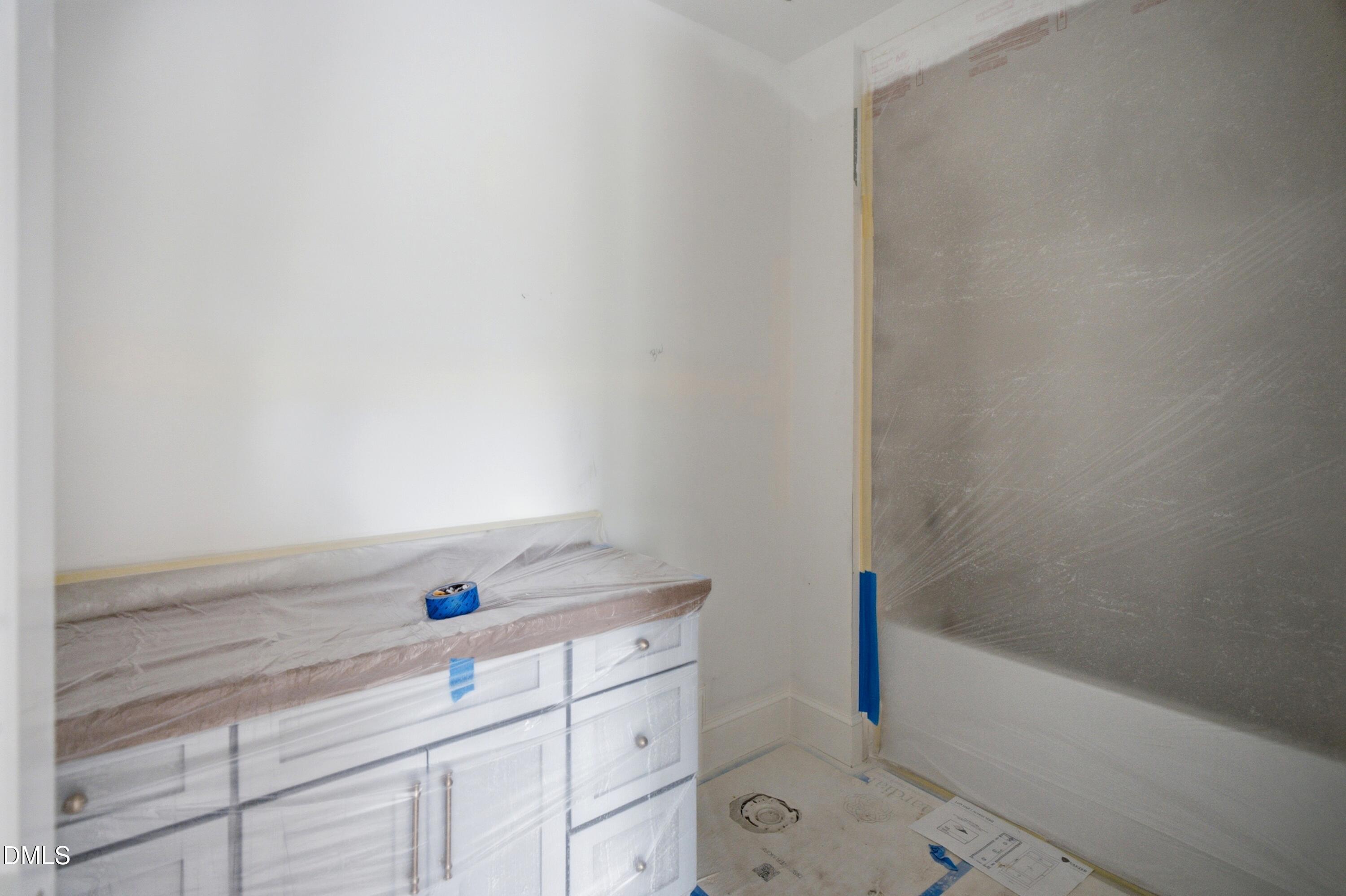 3438 Leonard Street Raleigh, NC 27607 - Photo 28 of 50 a bathroom with a bathtub and shower