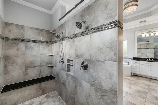 a bathroom with a tub sink and mirror