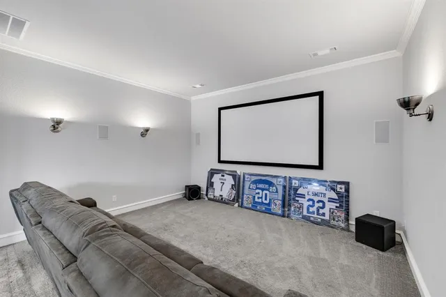 a bedroom with a bed next to a window