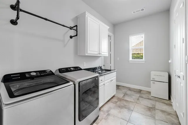 an aerial view of a house with outdoor space