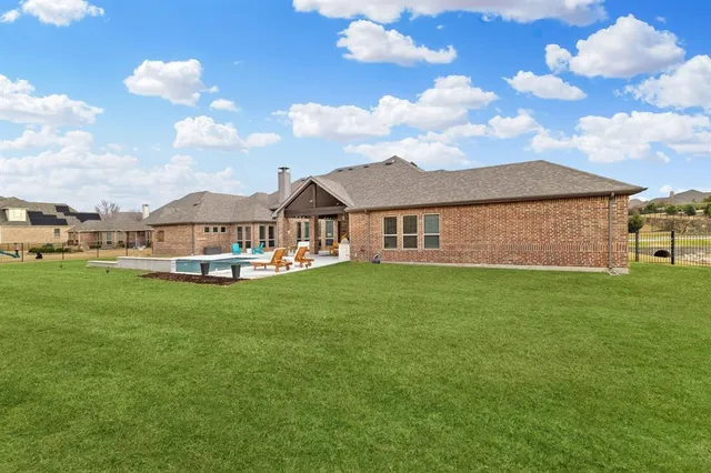 a view of a house with a big yard