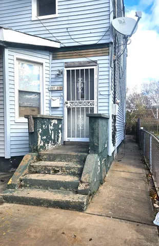a front view of a house with a porch
