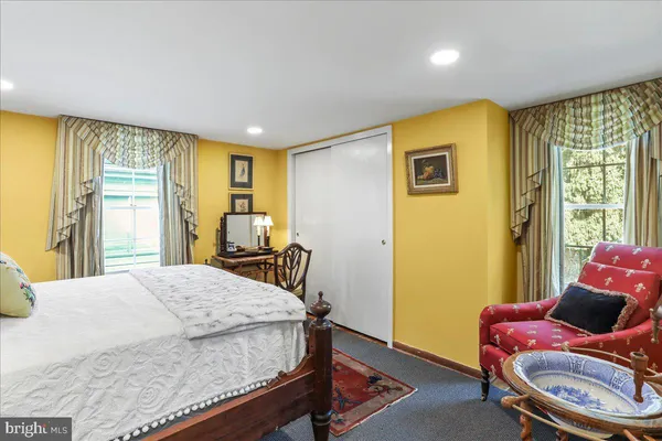 a view of a livingroom with furniture and a chandelier