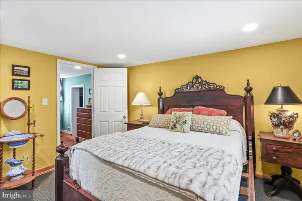 a bed room with a bed and a chandelier